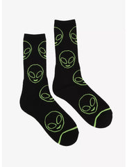 Black socks with green alien head designs on a white background