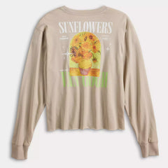 Beige long-sleeve shirt with sunflower graphic and text on a white background
