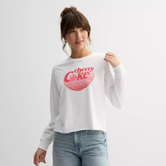 Person wearing a white sweatshirt with a red 'Coke' logo on a plain background