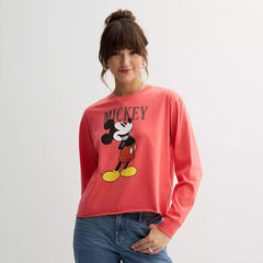 Person wearing a red 'Mickey' shirt with a white background