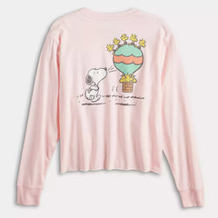 Pink long-sleeve shirt with a cartoon design of a dog and a hot air balloon on a white background