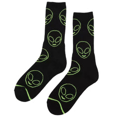 Black socks with green alien face patterns on a white background