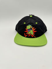 Black cap with green brim and alien graphic on a white background